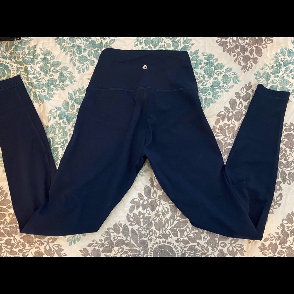 Lululemon size 4 wunder under dark blue leggings.